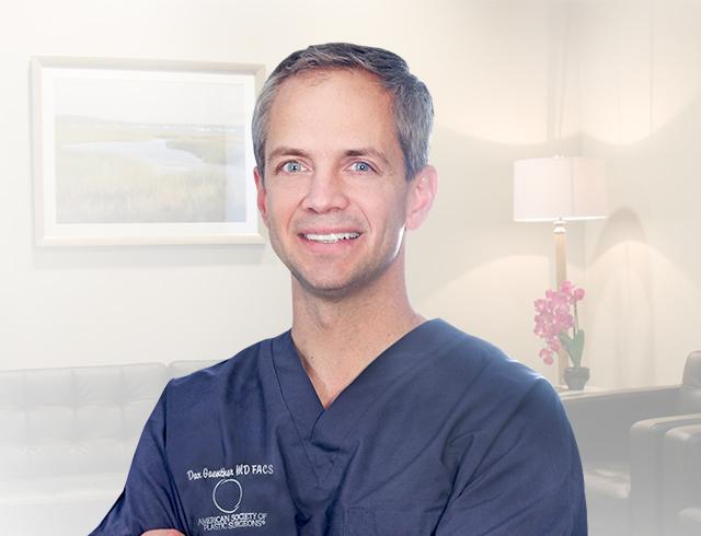 Dr. Dax Guenther smiling with his arms crossed