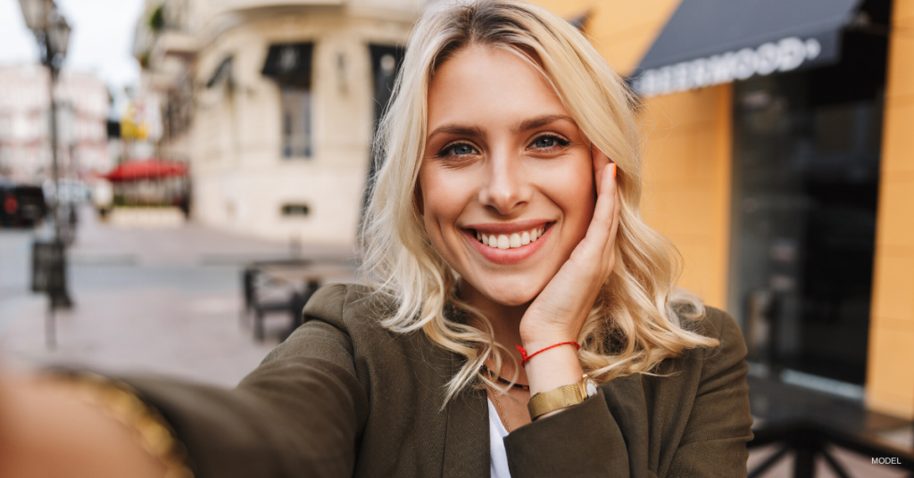 Woman taking a selfie for Instagram