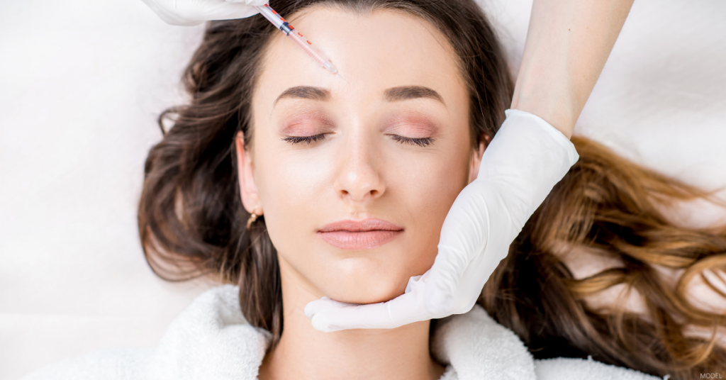 A woman receives injectable treatment.